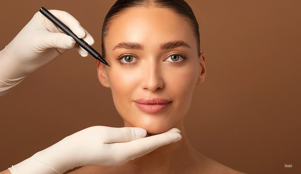 close-up of woman's face with dr marking near her eye.