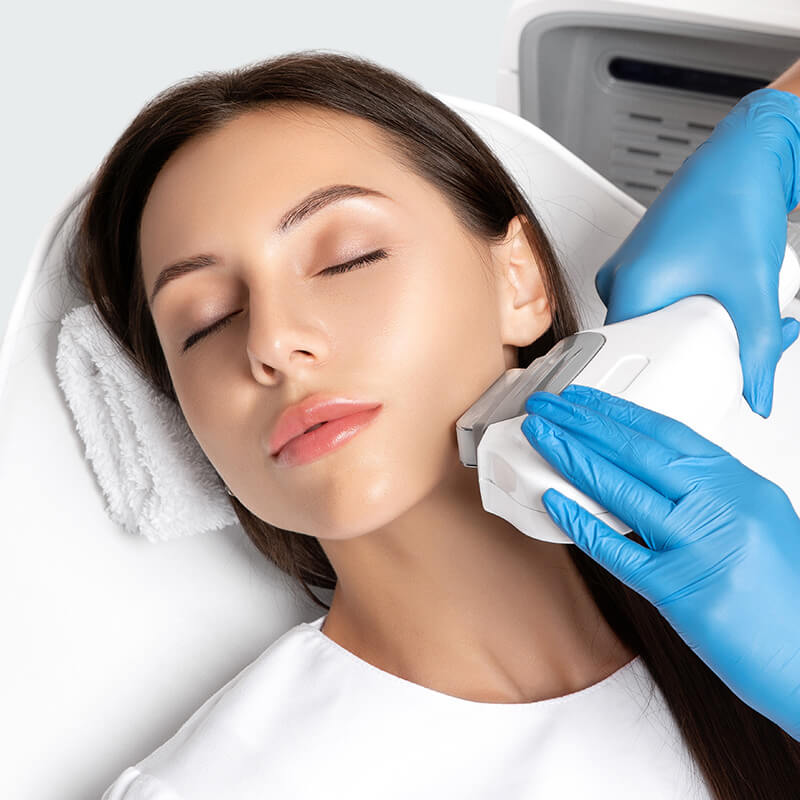 Woman getting a laser treatment on her face