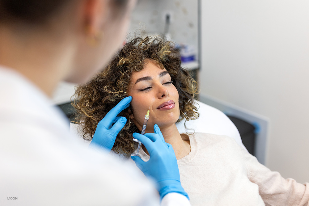 Woman getting a facial injection
